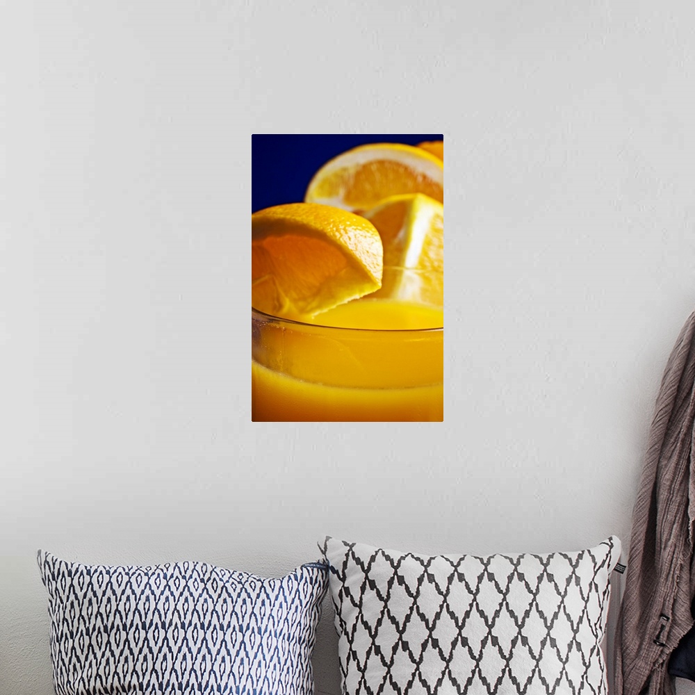 A bohemian room featuring Close-up of a refreshing glass of orange juice.