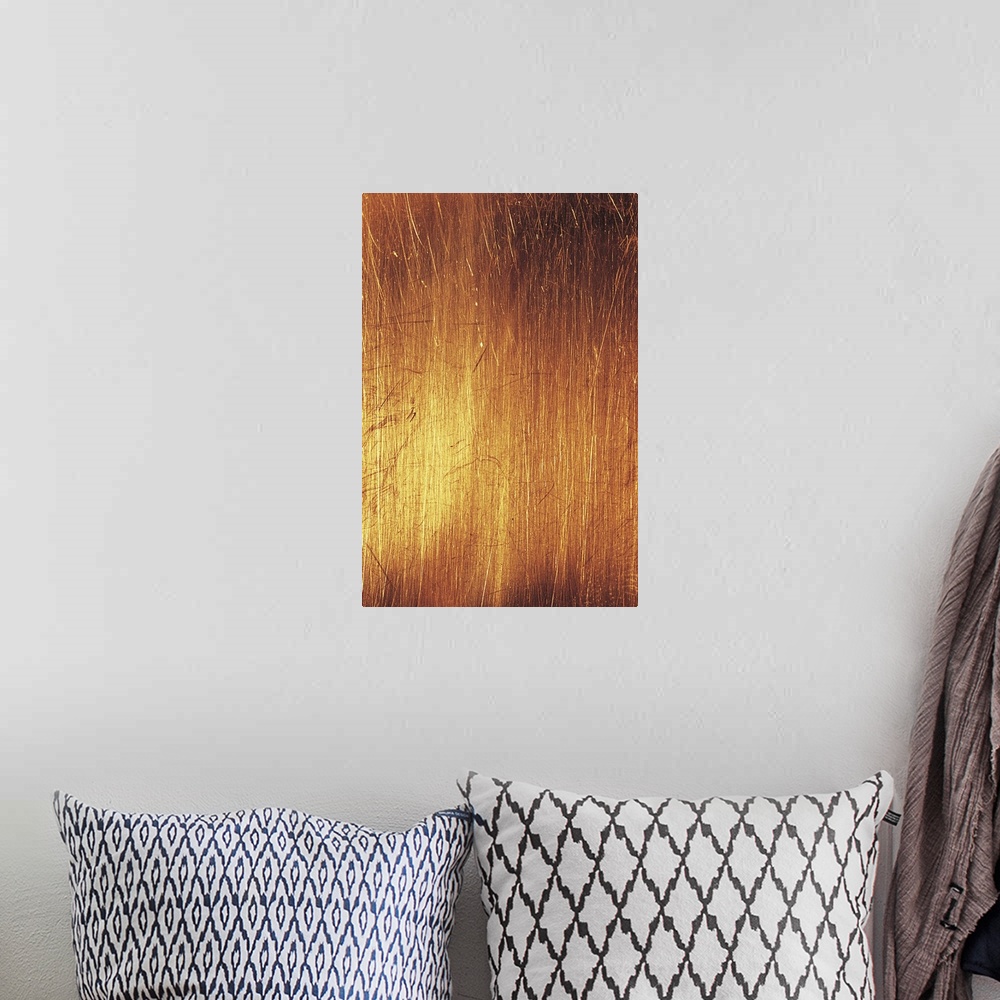 A bohemian room featuring Vertical abstract painting of different lines etched together closely with warm tones.