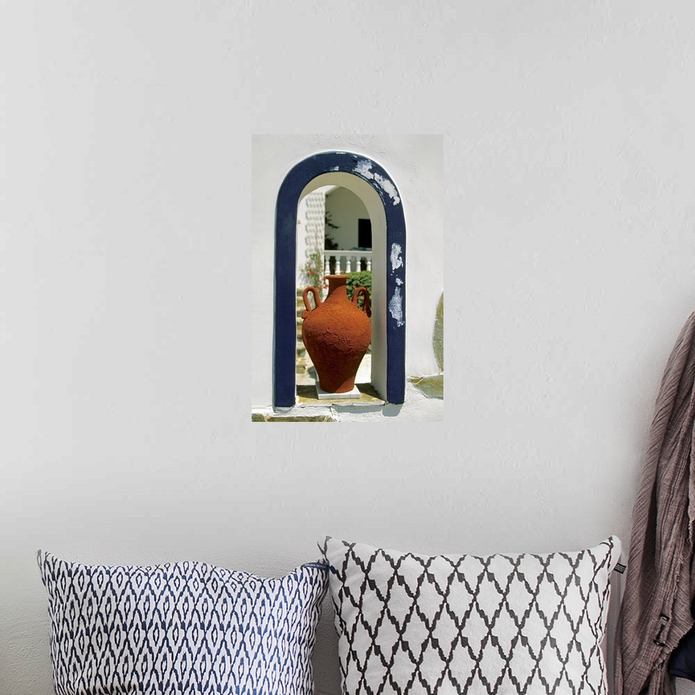 A bohemian room featuring Decorative vase placed on an arched window of a house, Santorini, Greece