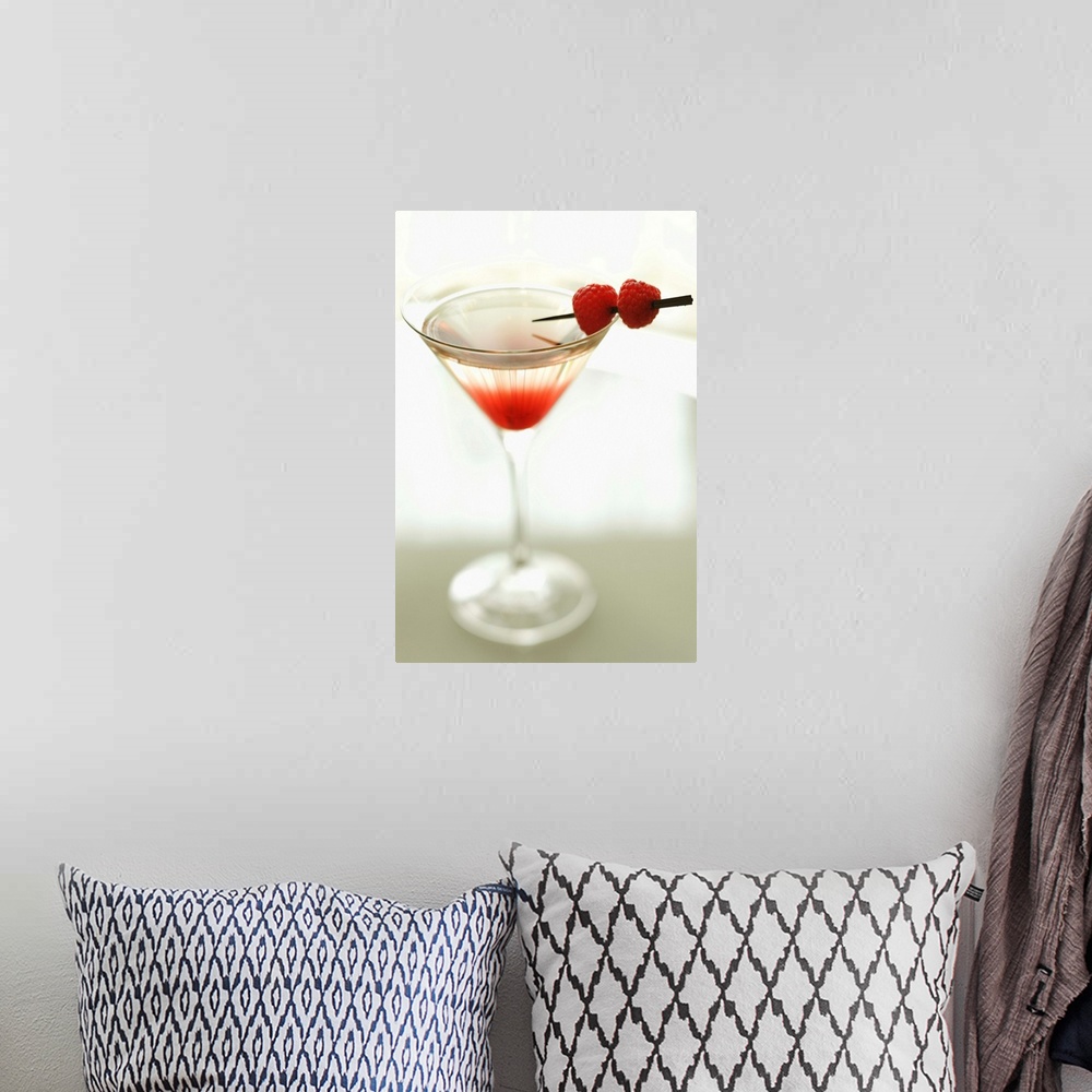 A bohemian room featuring Drink in martini glass with raspberries