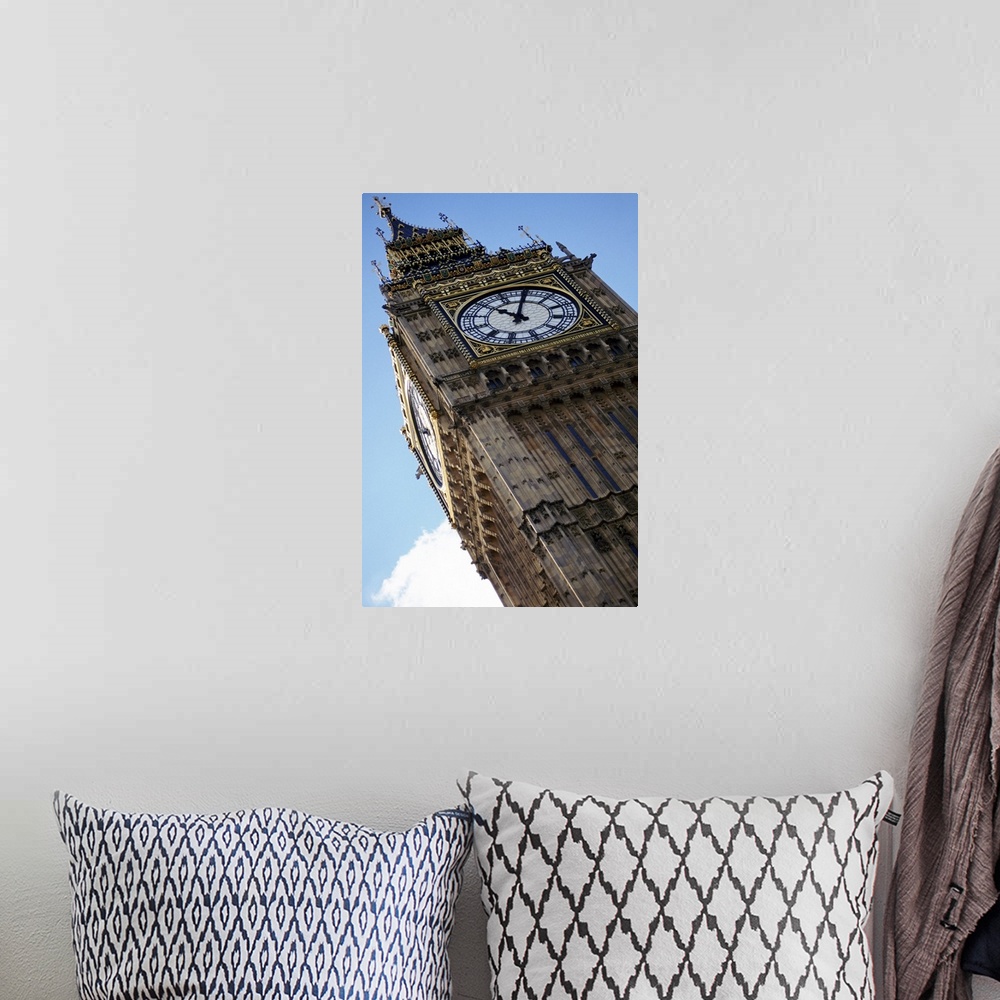 A bohemian room featuring Big Ben is photographed from below showing mostly the top of the structure at an angle.