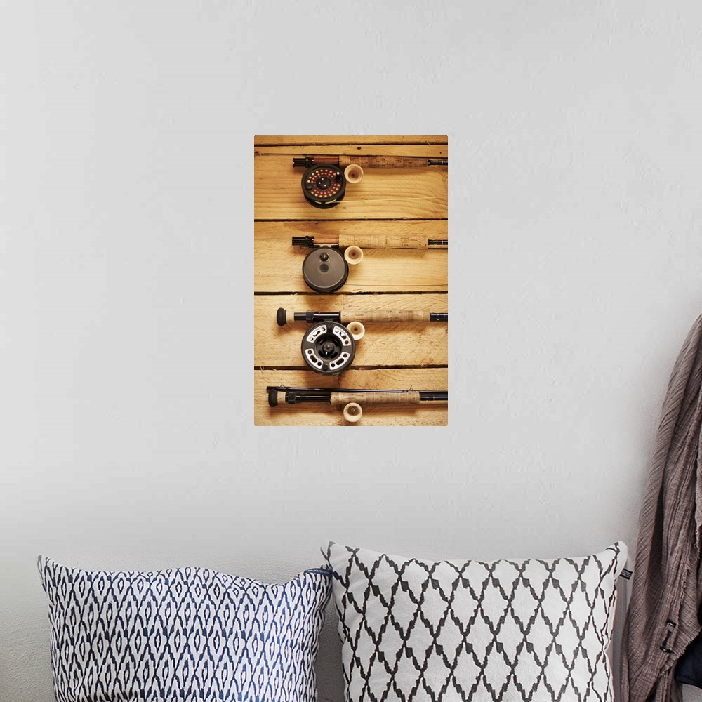 A bohemian room featuring Fly fishing reels hanging on wall