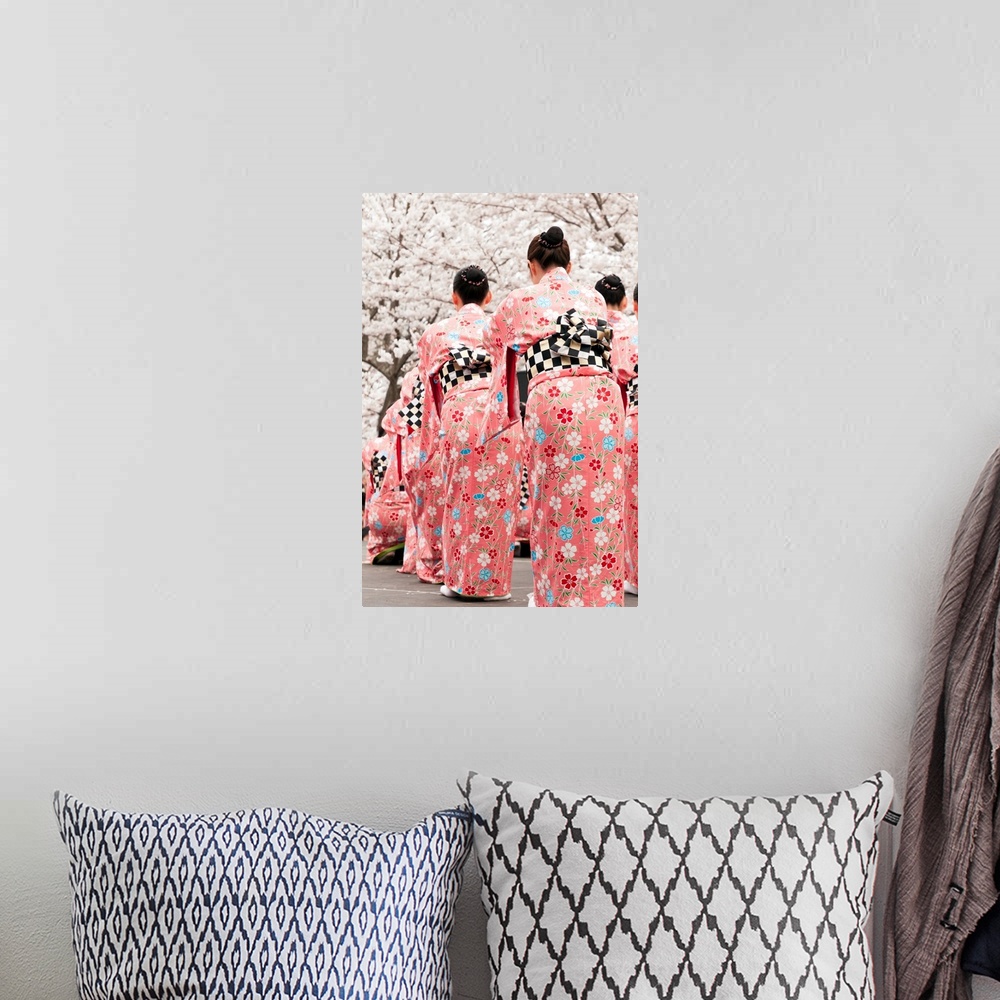 A bohemian room featuring Group of female Japanese dancers in traditional costumes celebrate cherry blossom at spring festival
