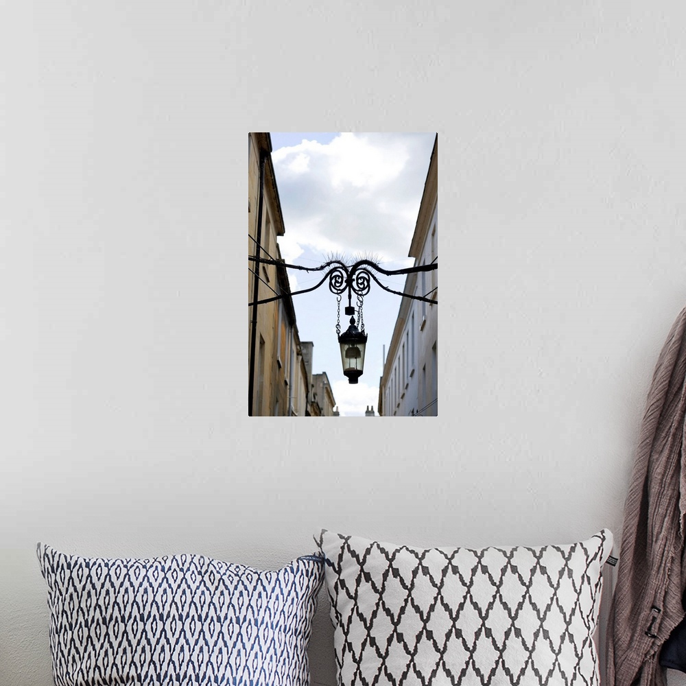 A bohemian room featuring Lamp hanging between buildings