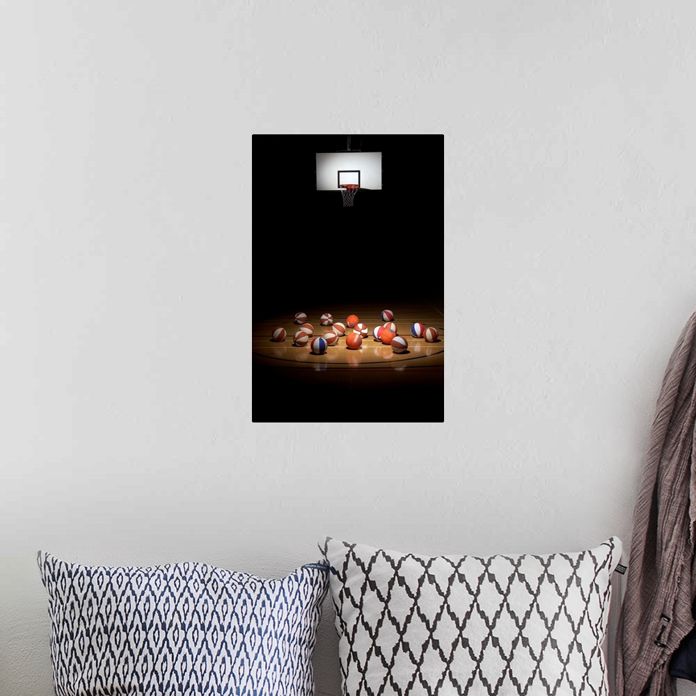 A bohemian room featuring Many basketballs resting on the floor