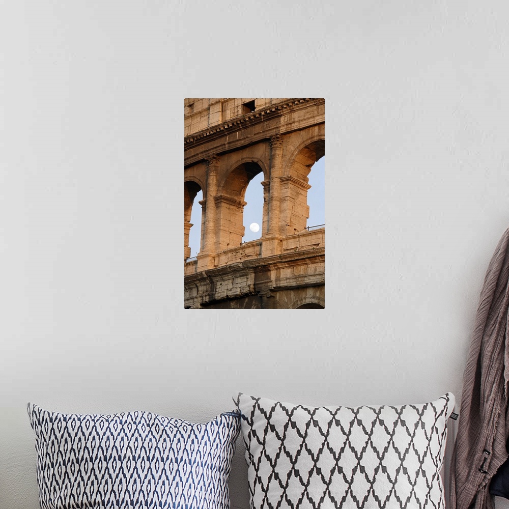 A bohemian room featuring Vertical photo on canvas of the moon shining through an opening of one of the arches in the Colos...