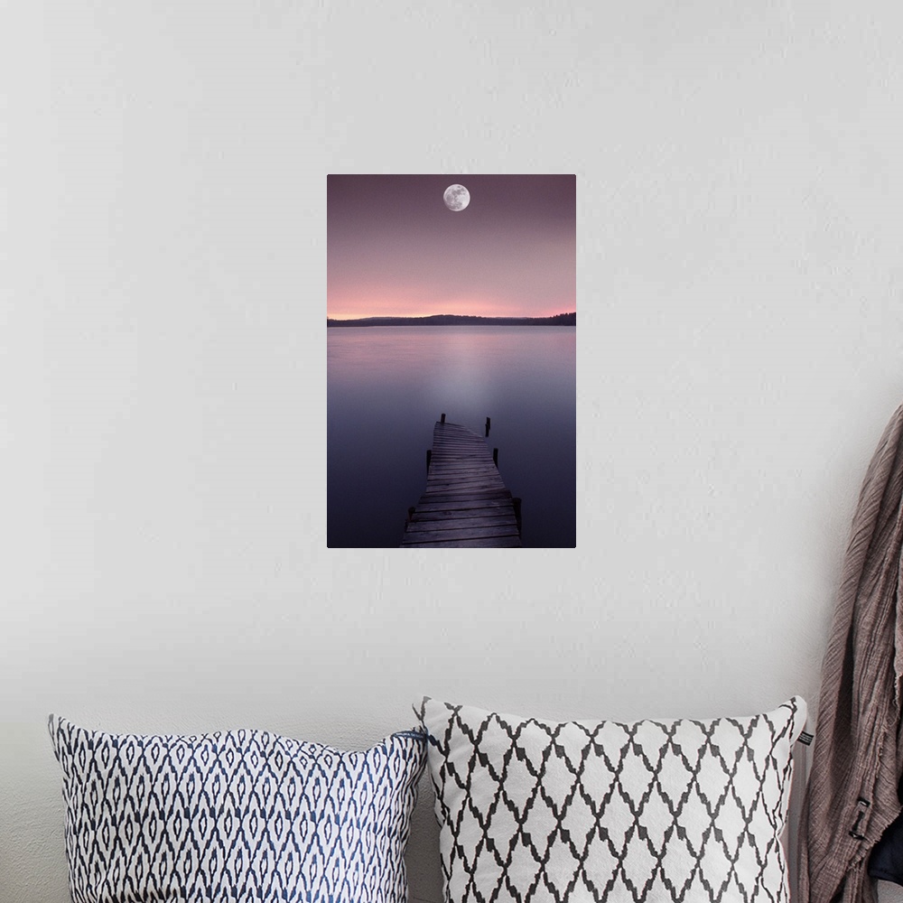 A bohemian room featuring Moon over lake with pier at dusk