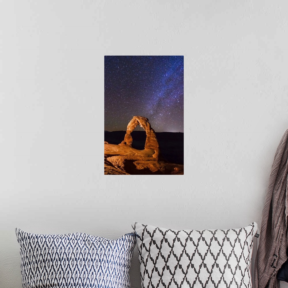 A bohemian room featuring Night view of delicate arch and stars and Milky Way in southern sky, Arches National Park, Moab, ...