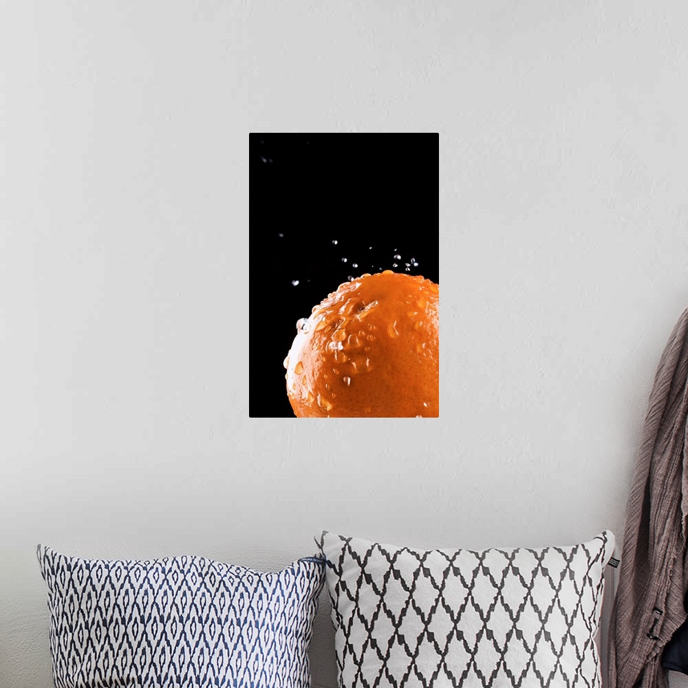 A bohemian room featuring Orange with water droplets splashing