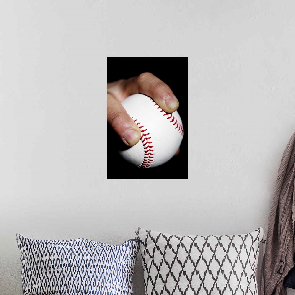 A bohemian room featuring Pitchers hand gripping a baseball