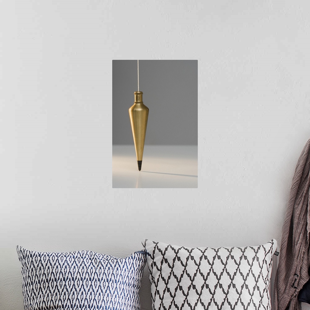 A bohemian room featuring Plumb bob suspended from plumb line
