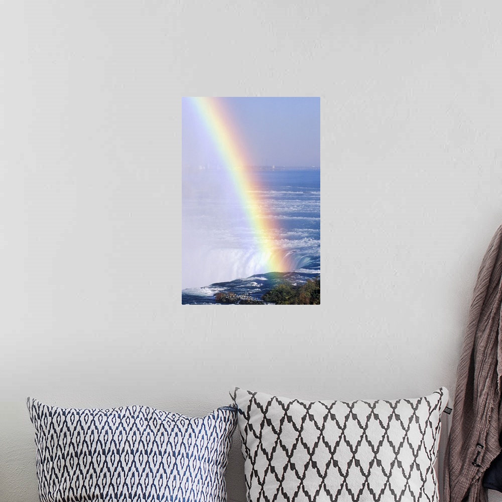 A bohemian room featuring 'Rainbow Over Niagara Falls, New York'