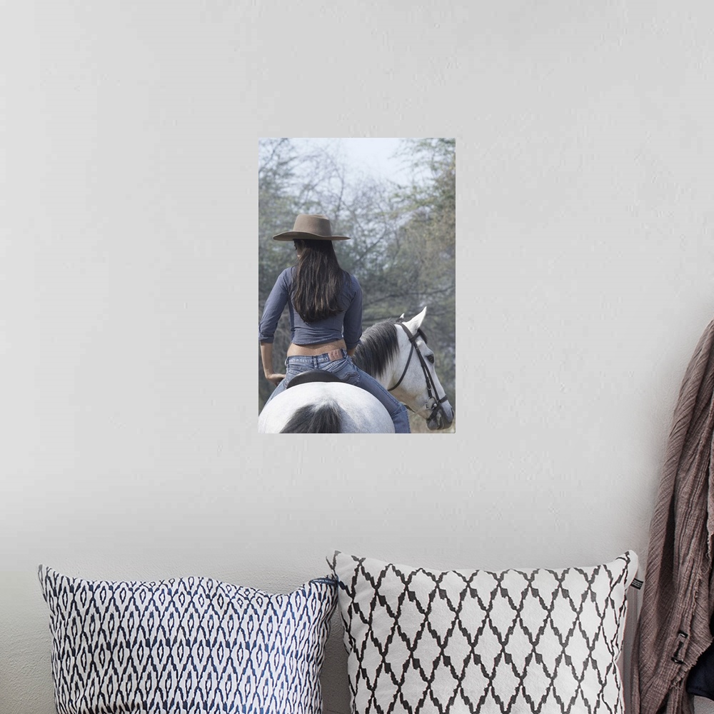 A bohemian room featuring Rear View Of A Woman Riding A Horse