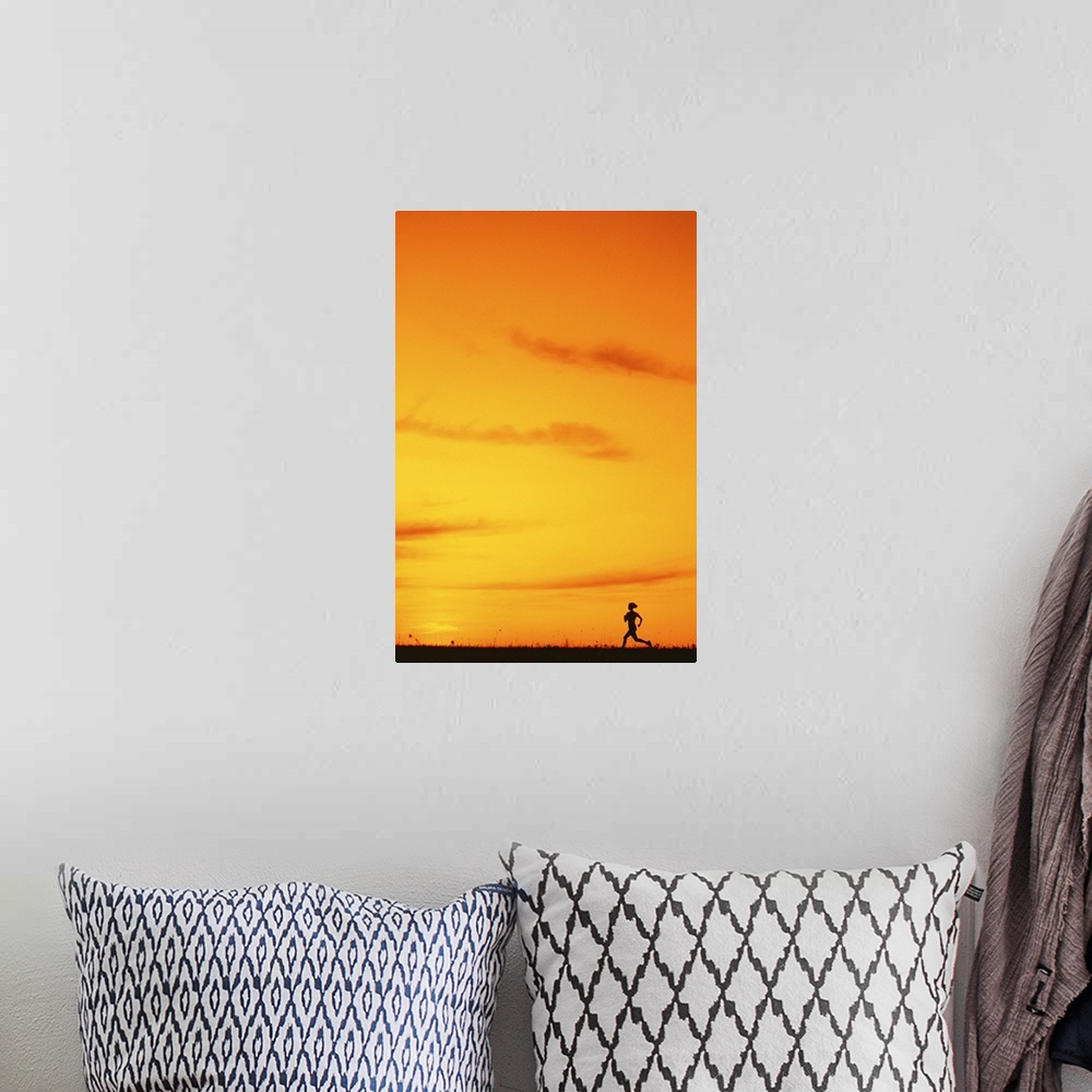 A bohemian room featuring Silhouette of runner at sunset