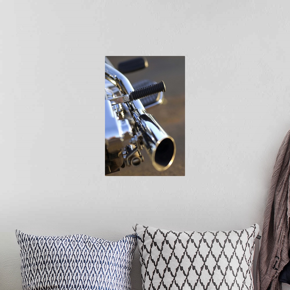 A bohemian room featuring Still-life close-up of a chrome tailpipe of a motorcycle