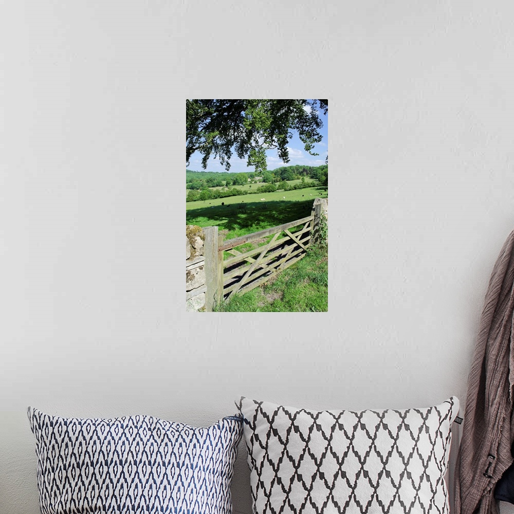 A bohemian room featuring View of gate and farmland in english cotswolds.