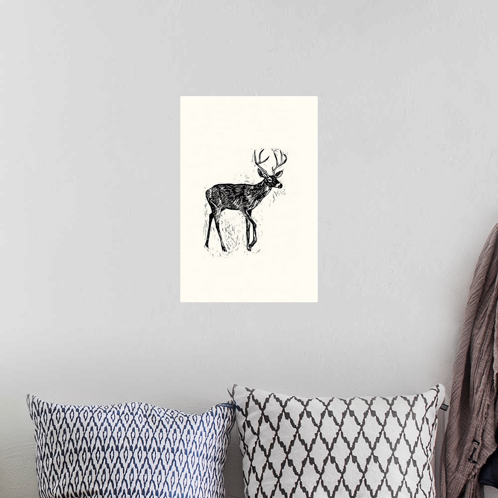 A bohemian room featuring Black and white block print illustration of a deer on an off white background.