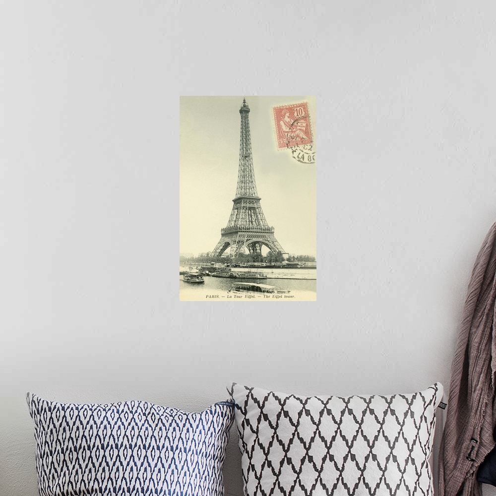 A bohemian room featuring Vintage postcard of the Eiffel Tower in Paris, France, with a postage stamp on the front.