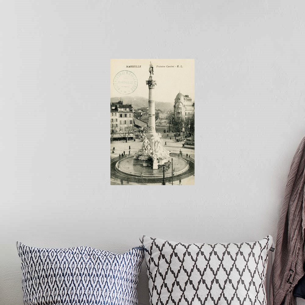 A bohemian room featuring Vintage postcard of a monument in Marseille, France.