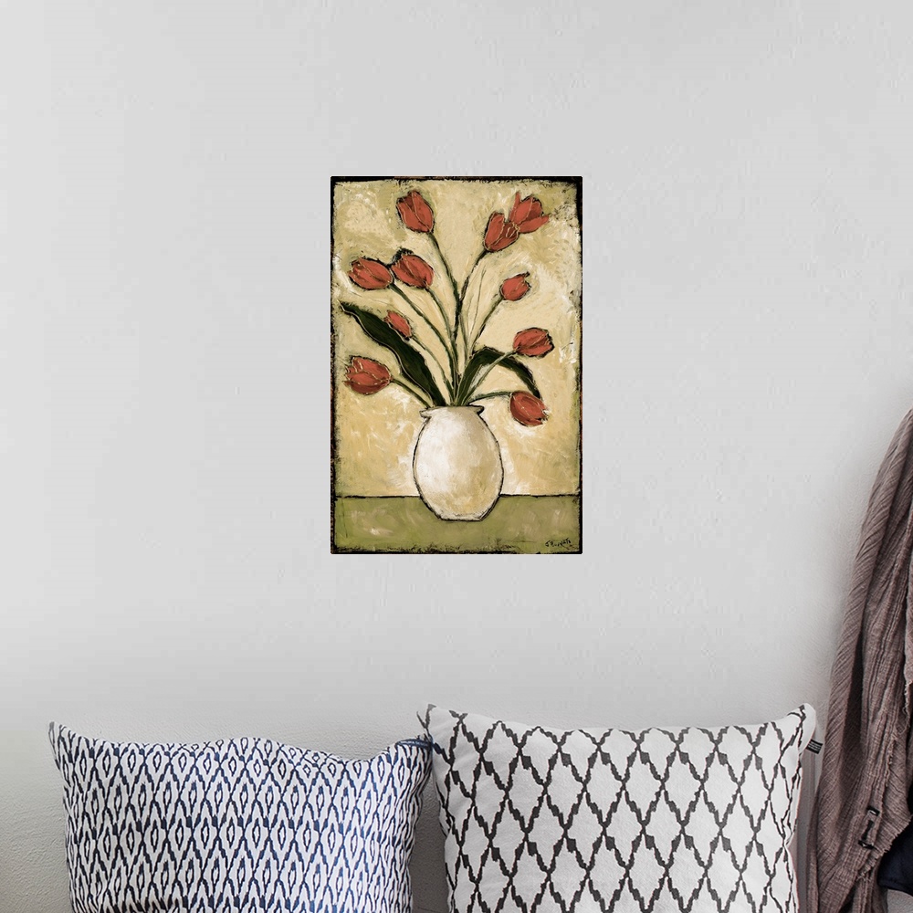 A bohemian room featuring Contemporary painting of a bouquet of red tulips over a light background.