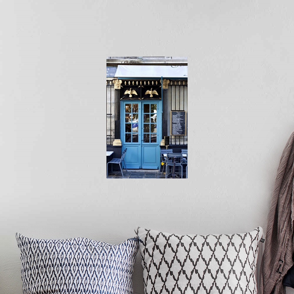 A bohemian room featuring Blue doors of cafe, Marais District, Paris, France