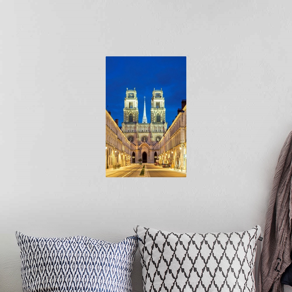 A bohemian room featuring Facade of Orleans Cathedral (Basilique Cathedrale Sainte-Croix) seen down Rue Jeanne d'Arc at dus...