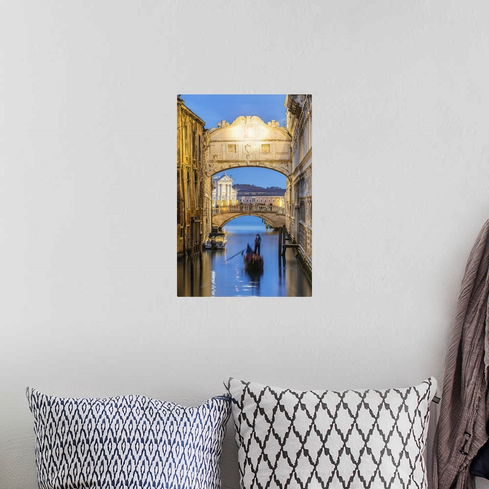 A bohemian room featuring Italy, Veneto, Venice. Bridge of sighs illuminated at dusk with gondolas