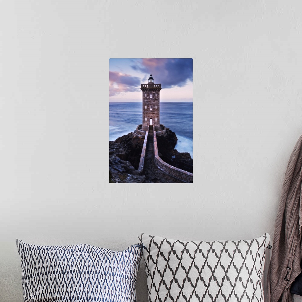 A bohemian room featuring Kermorvan lighthouse at dawn in Brittany, France.