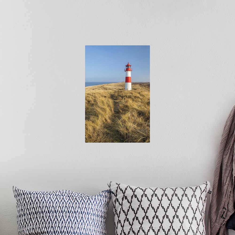 A bohemian room featuring Path on the dune to the List-Ost lighthouse on the Ellenbogen Peninsula, Sylt, Schleswig-Holstein...