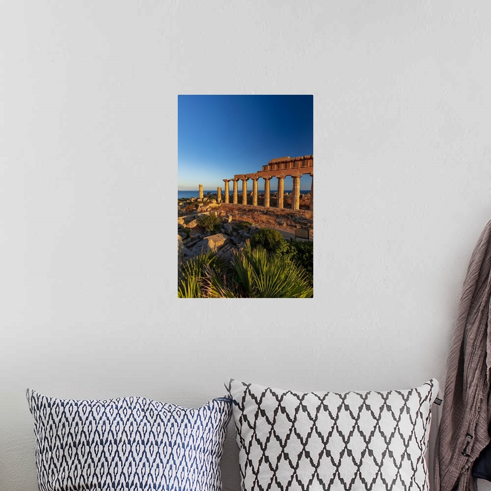 A bohemian room featuring Selinunte, Sicily. Greek temple at sunset with the sea in the background