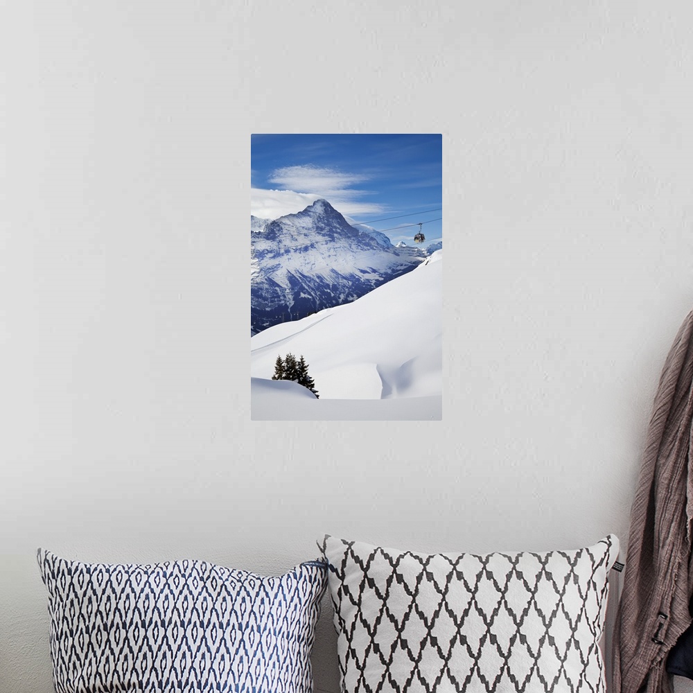 A bohemian room featuring Ski Gondola lift in front of the North face of the Eiger mountain, Grindelwald, Jungfrau region, ...
