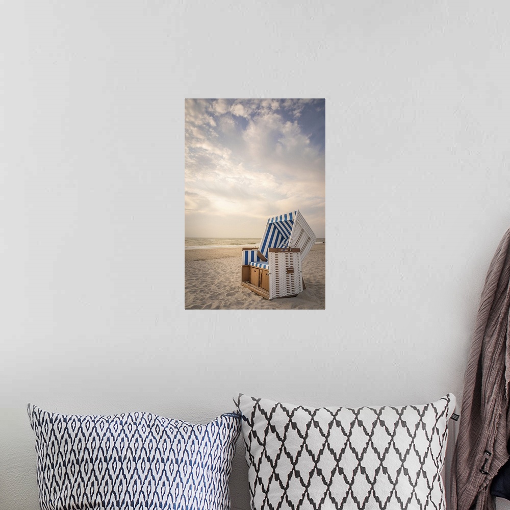 A bohemian room featuring Sylt beach chair in the soft evening light, Kampen, Sylt, Schleswig-Holstein, Germany.