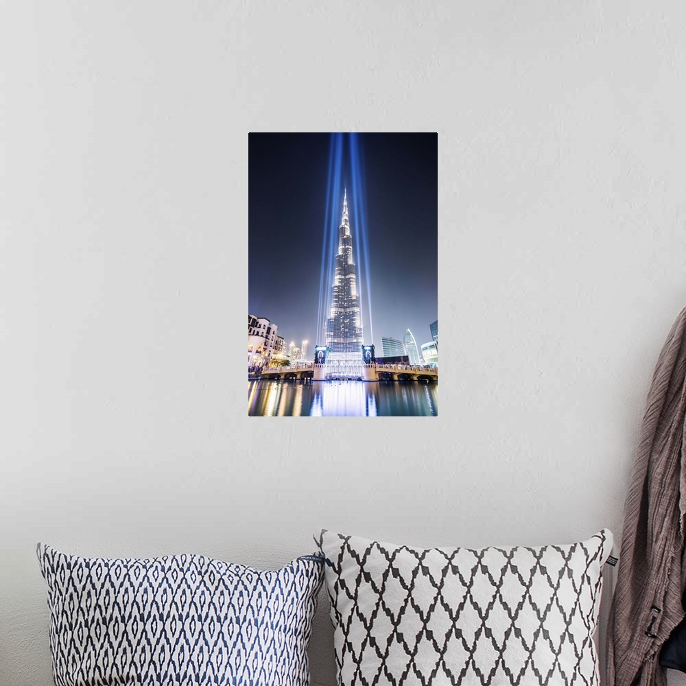 A bohemian room featuring United Arab Emirates, Dubai. Burj Khalifa at dusk, with light show