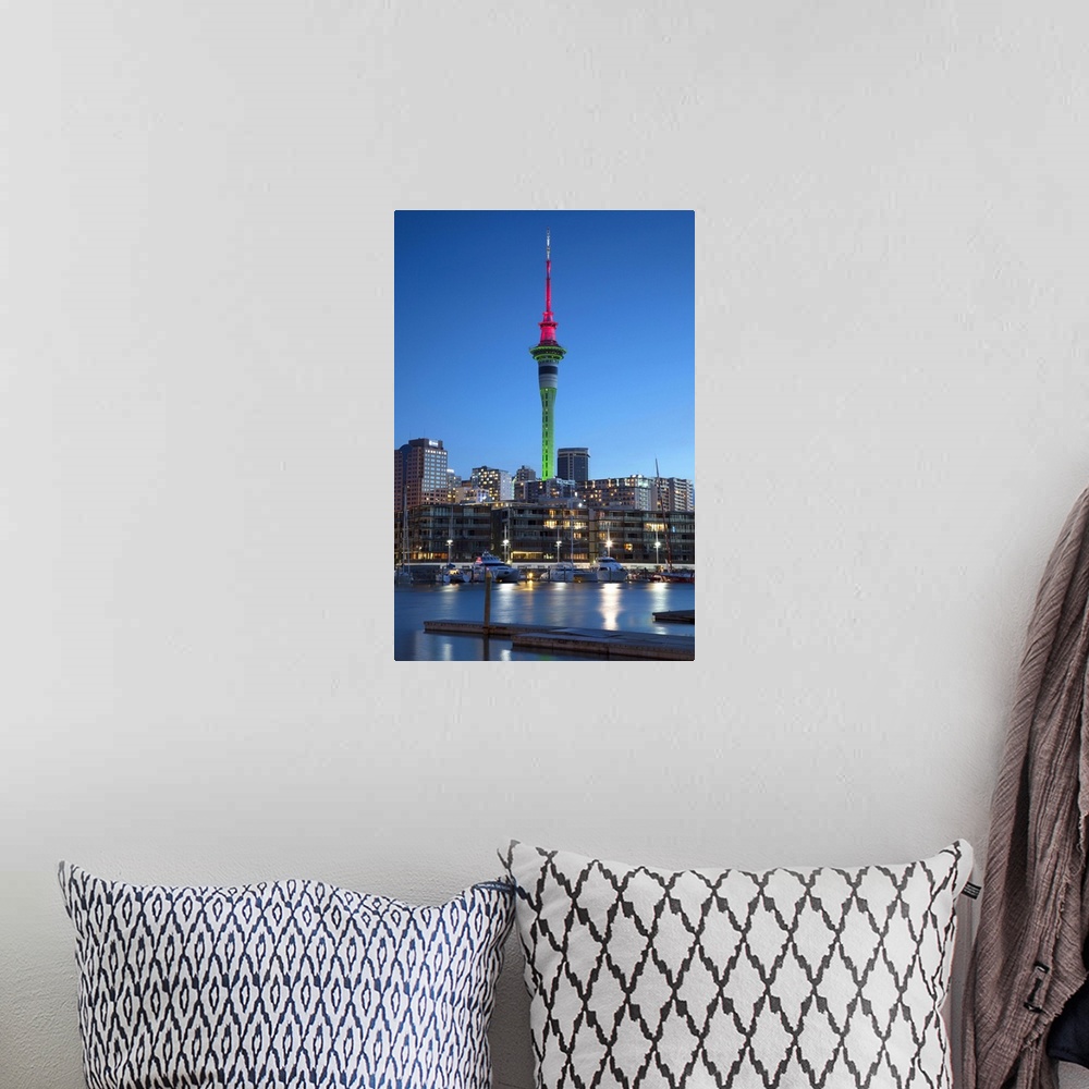 A bohemian room featuring Viaduct Harbour and Sky Tower at dusk, Auckland, North Island, New Zealand