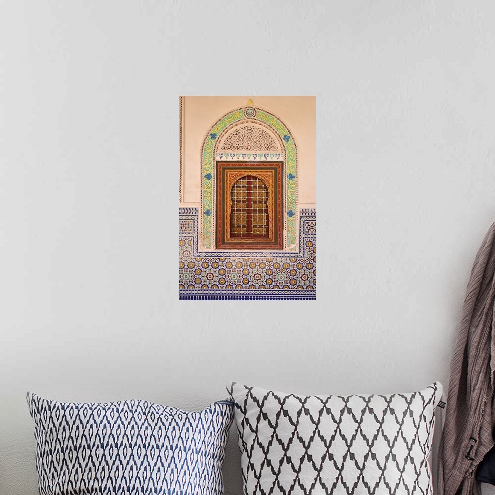 A bohemian room featuring Wood carving and stucco work in a window at the Zaouia Naciri in Tamegroute. Zagora region, Draa ...