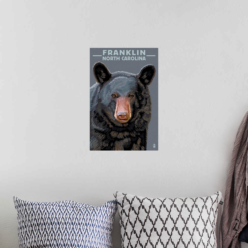 A bohemian room featuring Retro stylized art poster of an adult black bear's head and shoulders.