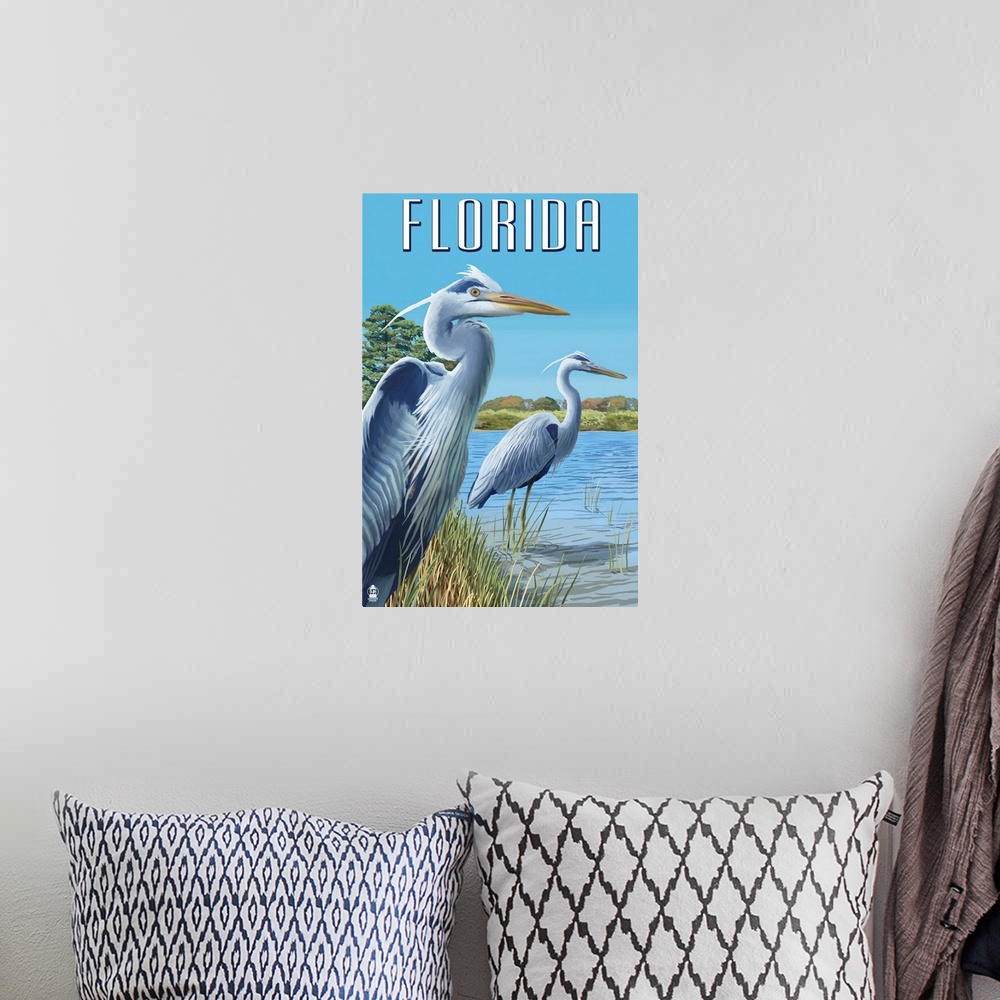 A bohemian room featuring Retro stylized art poster of two blue herons standing at the edge of a river.