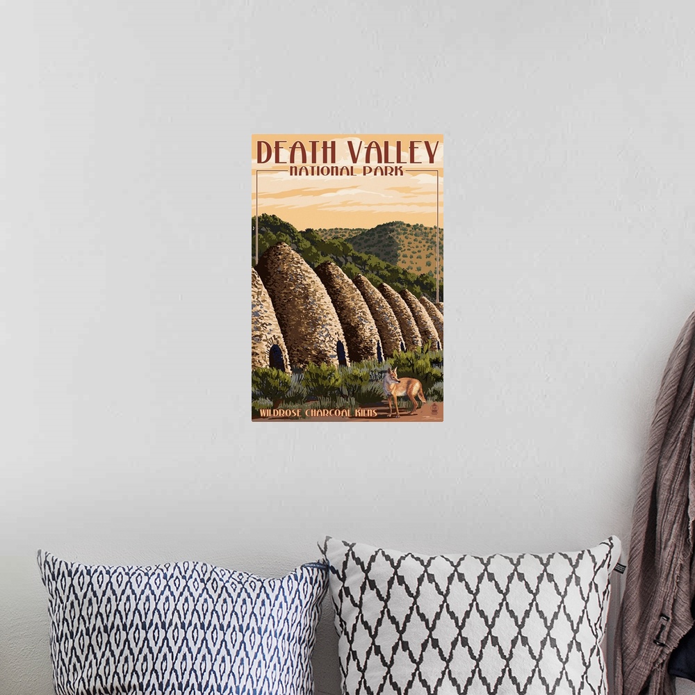 A bohemian room featuring Retro stylized art poster of a coyote walking past dome shaped kilns in the desert.