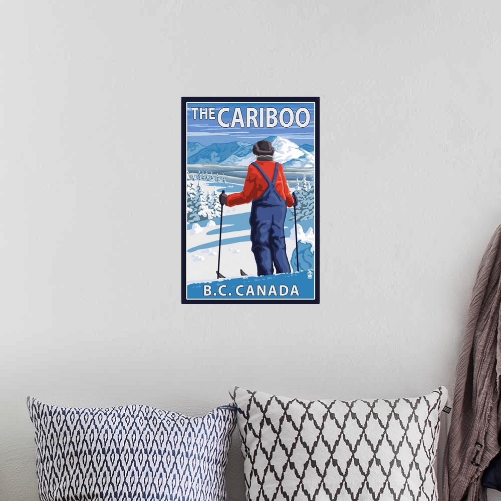 A bohemian room featuring Retro stylized art poster of a skier stopped and gazing out over a snowy mountainous landscape.