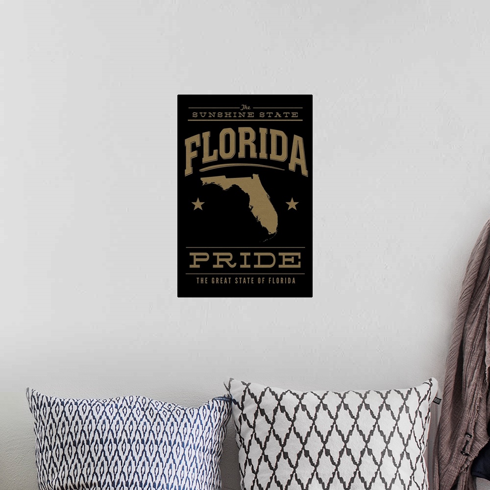 A bohemian room featuring The Florida state outline on black with gold text.