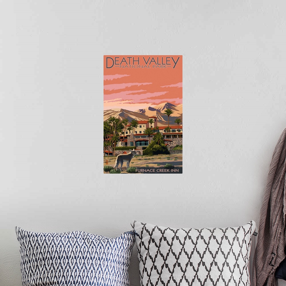A bohemian room featuring A retro sylized art poster of a desert resort built at the foot of a mountain and a coyote standi...