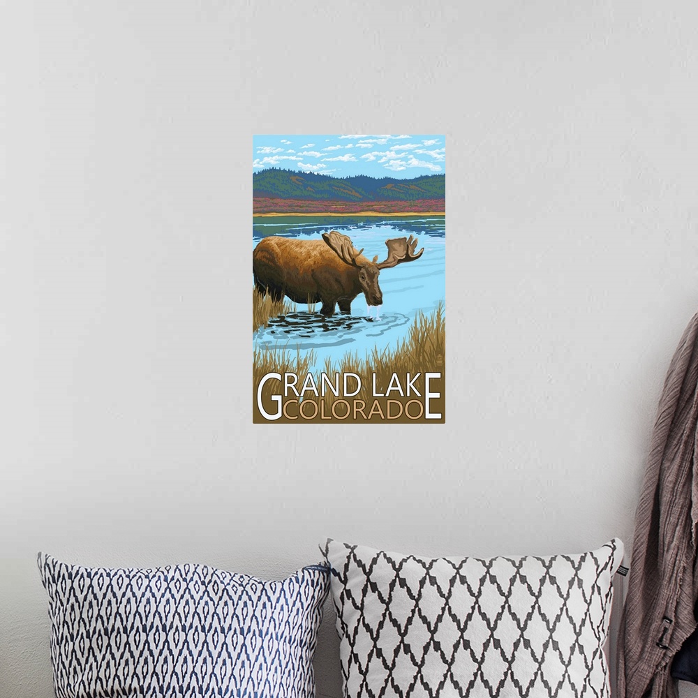 A bohemian room featuring Retro stylized art poster of a moose standing in a stream drinking, with mountains in the backgro...