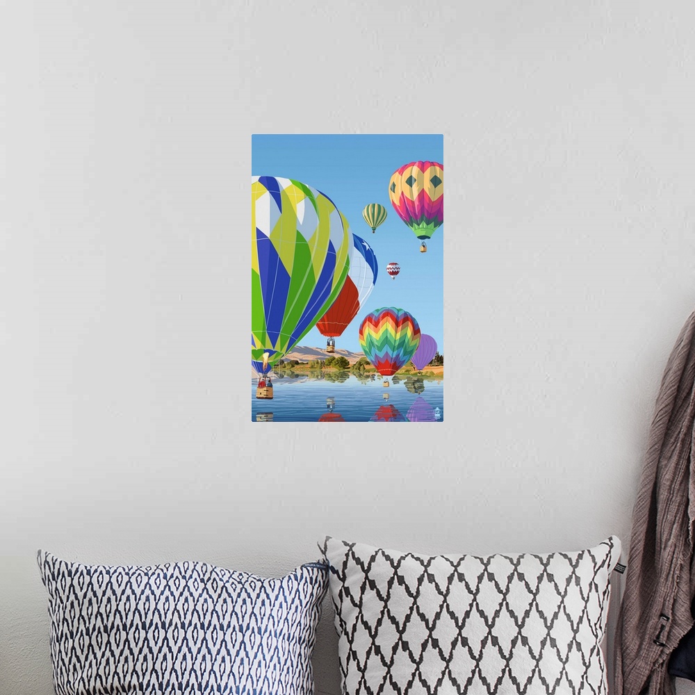 A bohemian room featuring Retro stylized art poster of a fleet of hot air balloons over water.