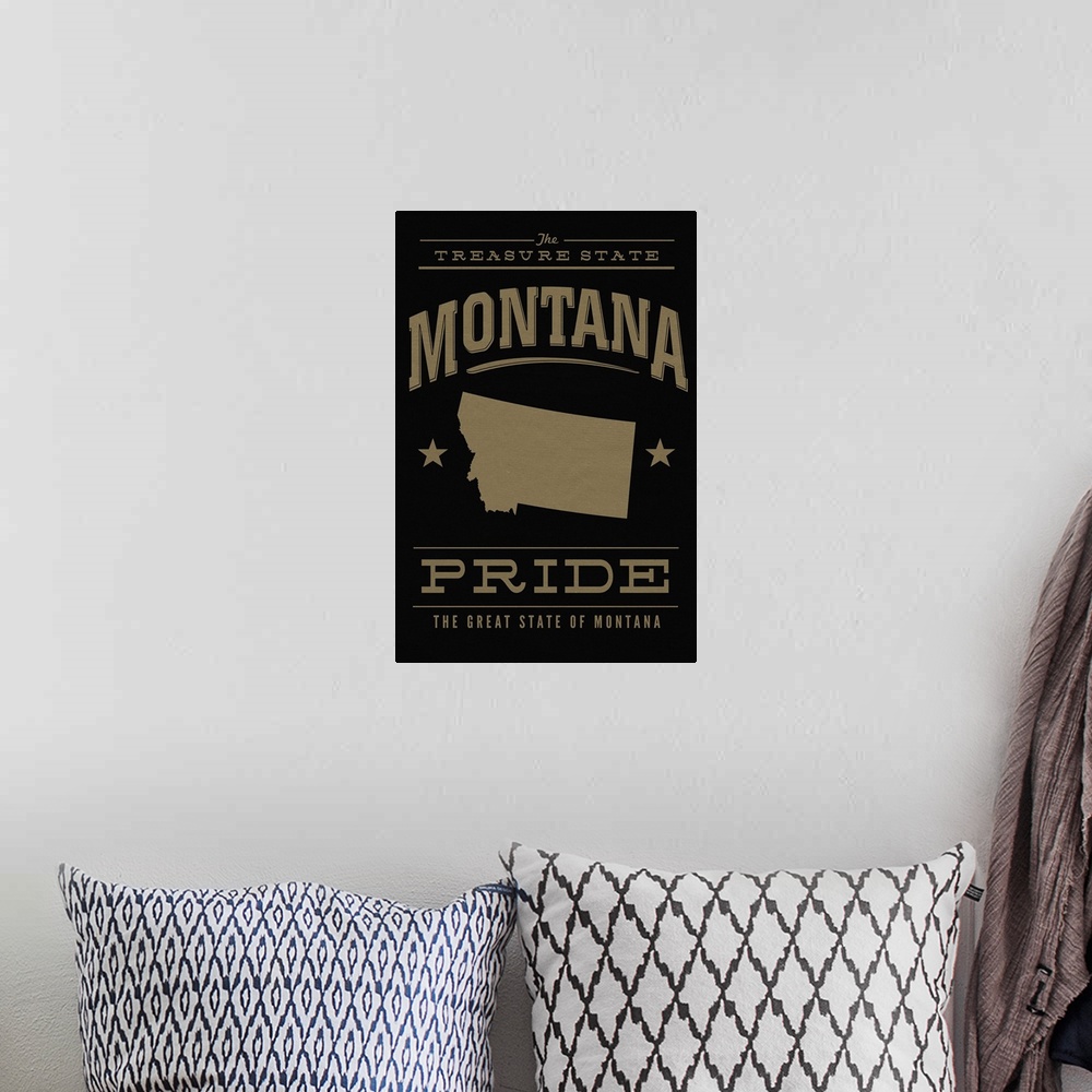 A bohemian room featuring The Montana state outline on black with gold text.