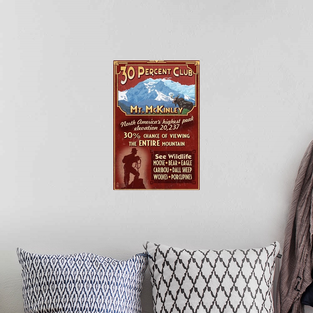 A bohemian room featuring Retro stylized art poster of a moose in the wild and the silhouette of a hiker at the bottom of t...