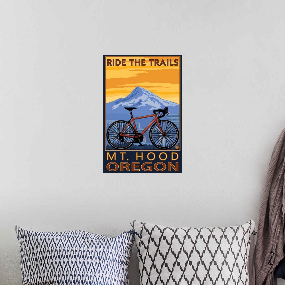 A bohemian room featuring Retro stylized art poster of a mountain bike, with a city skyline and mountain in the background.