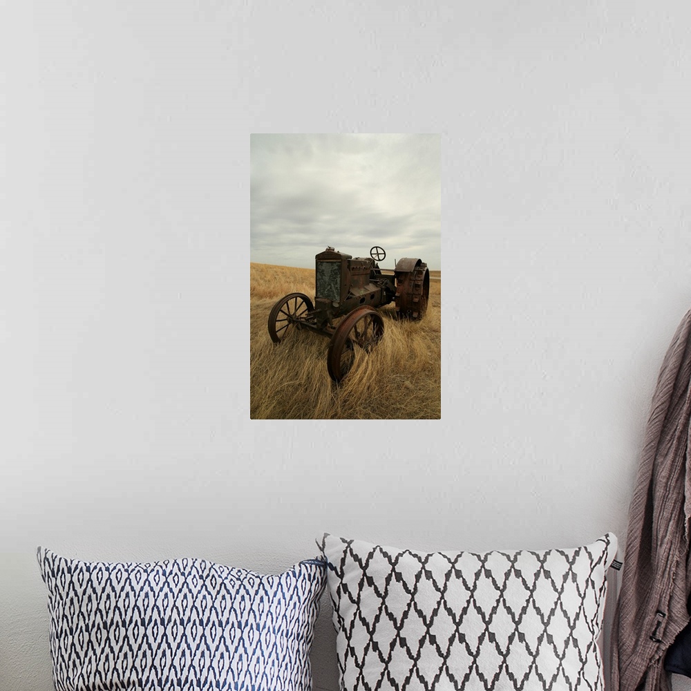 A bohemian room featuring Rusty Tractor In Field