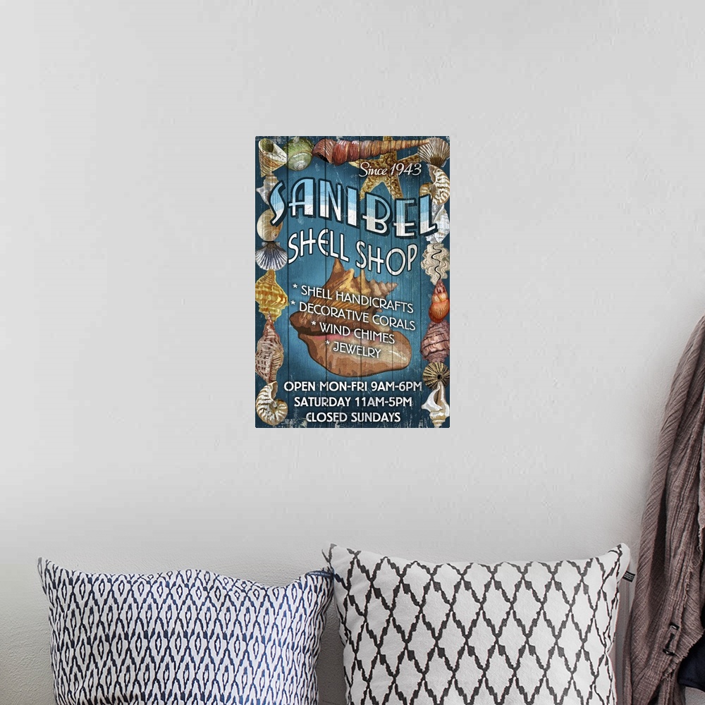 A bohemian room featuring Retro stylized art poster of a vintage sign with shell on it.