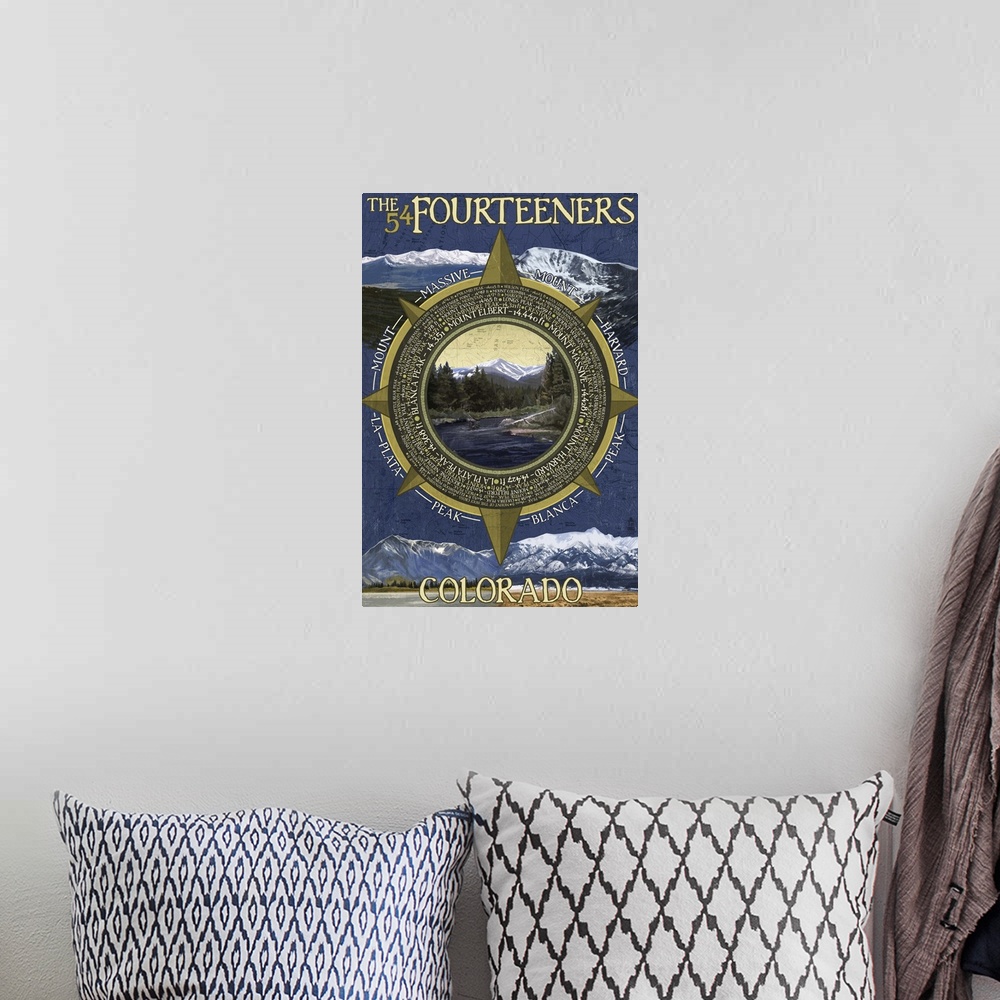 A bohemian room featuring Retro stylized art poster of a compass with a wilderness mountain scene in it.
