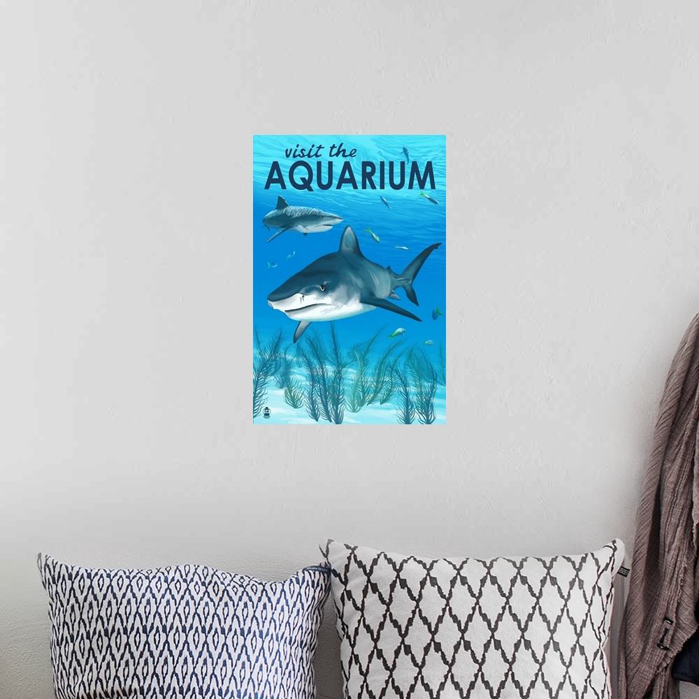 A bohemian room featuring Retro stylized art poster of two sharks swimming in clear blue water.